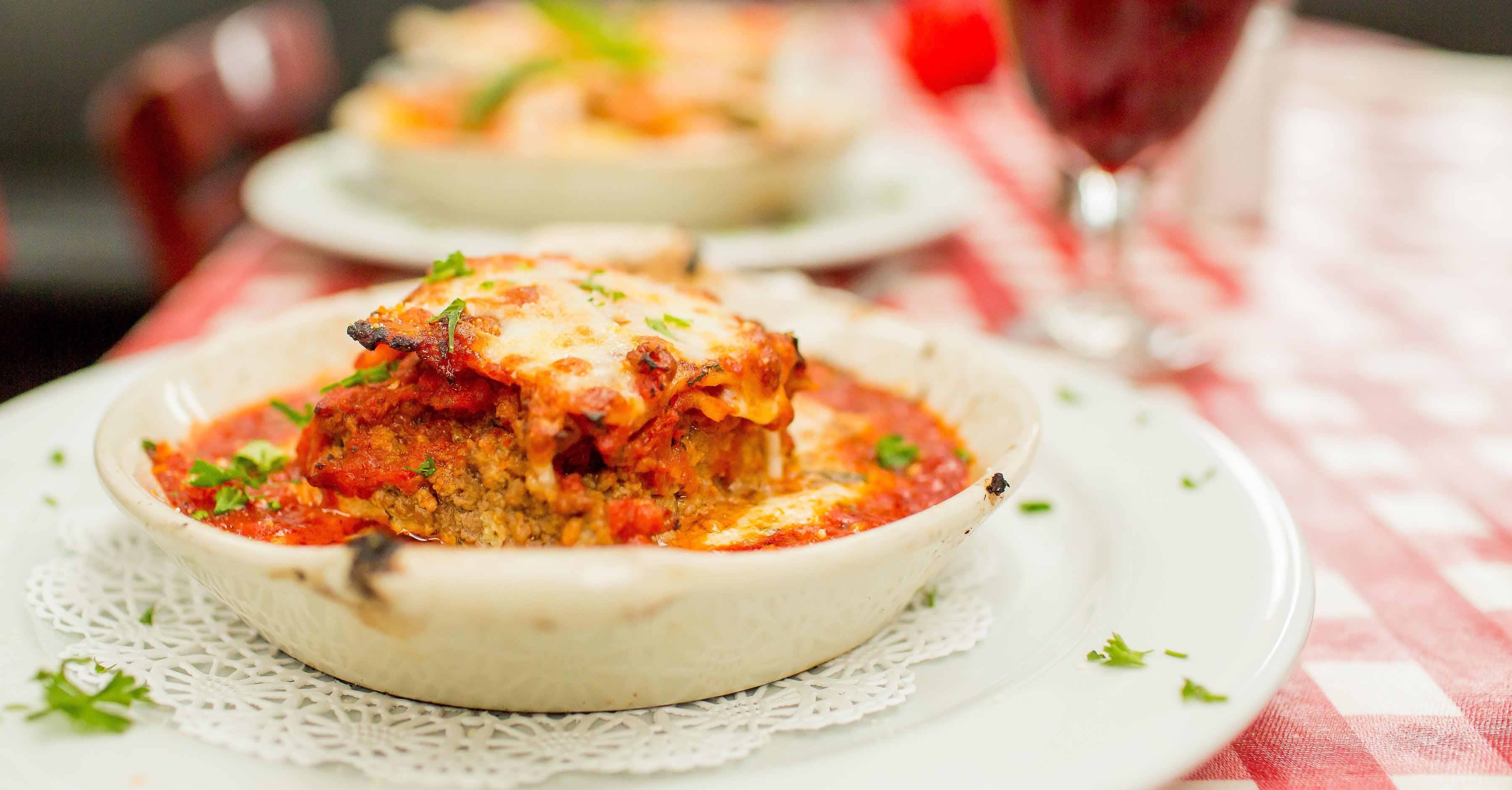 Homemade Meat Lasagna. Melted cheese and wine.